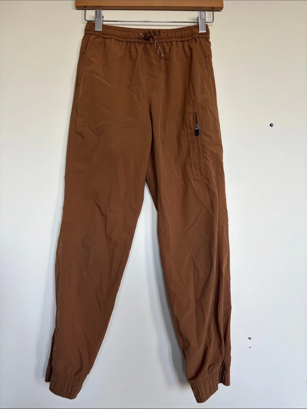 Nike Beige Pants with Light Blue Jeans and Brown Joggers